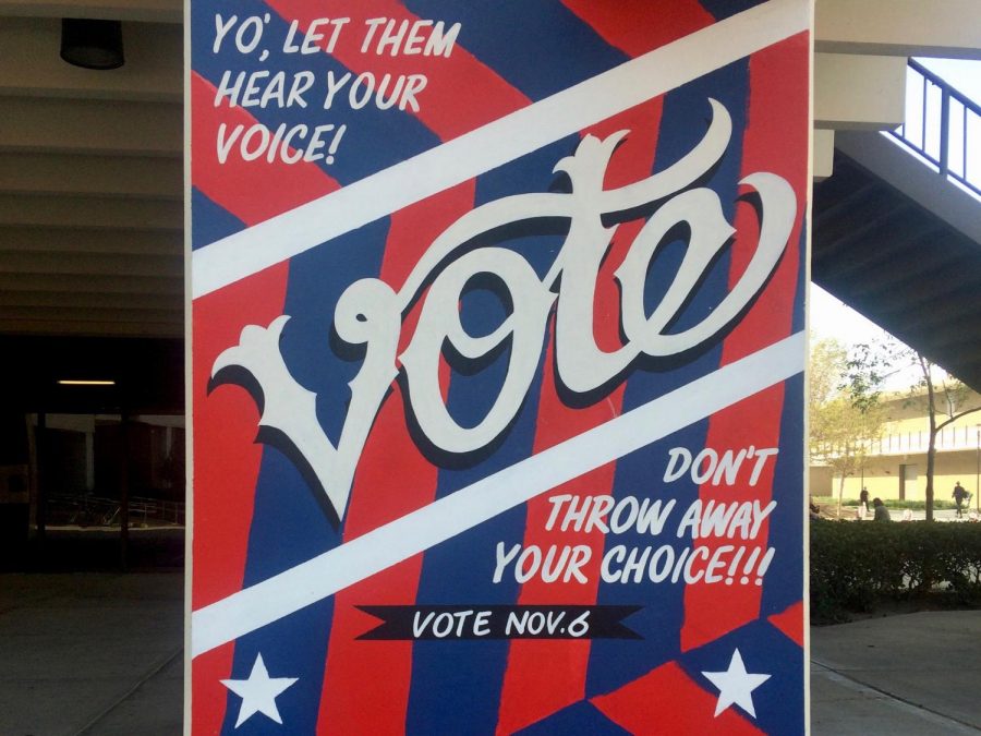 A local mural depicts the need to vote. 