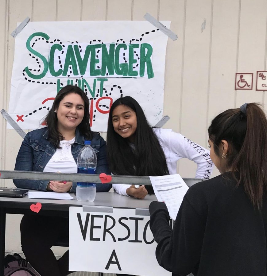 ASB members Josselyn Orozco and Itzel Quiroz give students clues to complete the scavenger hunt.  