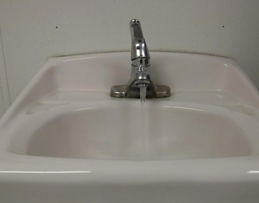 This is not staged. As I was walking into the mens restroom, I noticed that someone left the faucet on and water was being wasted.