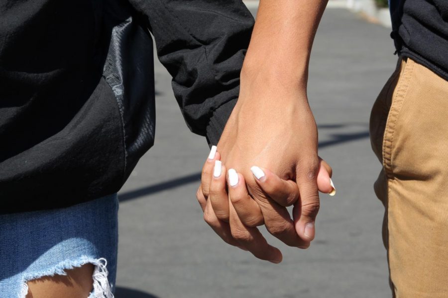 Many couples at MCHS show their love for each other through holding hands.