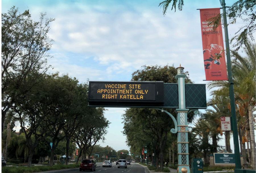 Traffic sign directs people towards the Disneyland Resort vaccination site in the Toy Story parking lot.