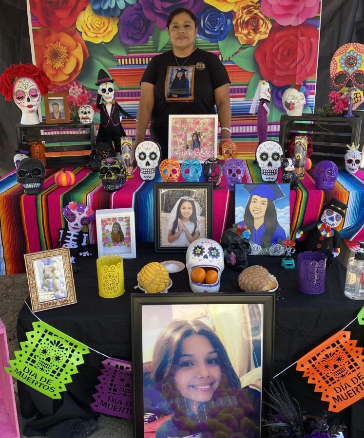 Eva Barrios showcases her booth which features her deceased daughter Victoria Barrios on Oct. 17, 2021 at La Gente Market, an event focusing on Día de los Muertos and Mexican Culture.