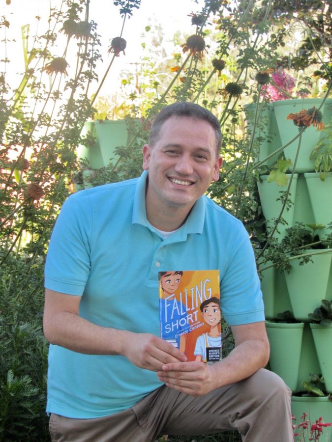 Santa Ana teacher Ernesto Cisneros shows his new book at Mendez Fundamental Intermediate School. 