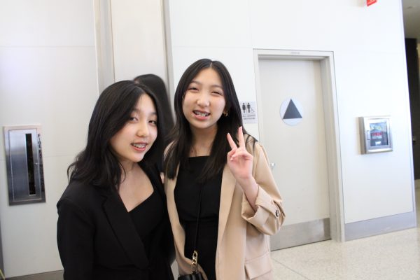 Abigail and Bethany Vu, a pair of twins at Middle College High School, get ready to head into class.