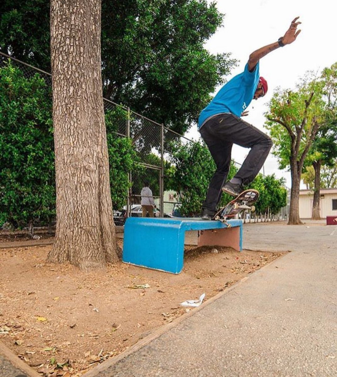 Ki Realer skates off of a public park bench in Los Angeles. 