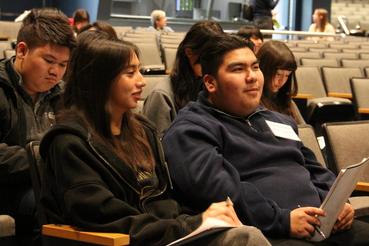 Seniors Abigail Ruiz and Emmanuel Rodriguez Mejia listen and take notes at the press conference during the OCJEA competition at Northwood High School in Irvine.  This photograph won 4th place in News Photography.